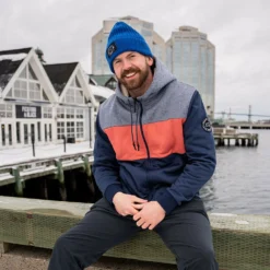 BAUER X EAST COAST LIFESTYLE ADULT SHERPA FULL ZIP HOODIE -HockeyPro Hub BAUER X EAST COAST LIFESTYLE MEN S SHERPA FULL ZIP HOODIE model sitting
